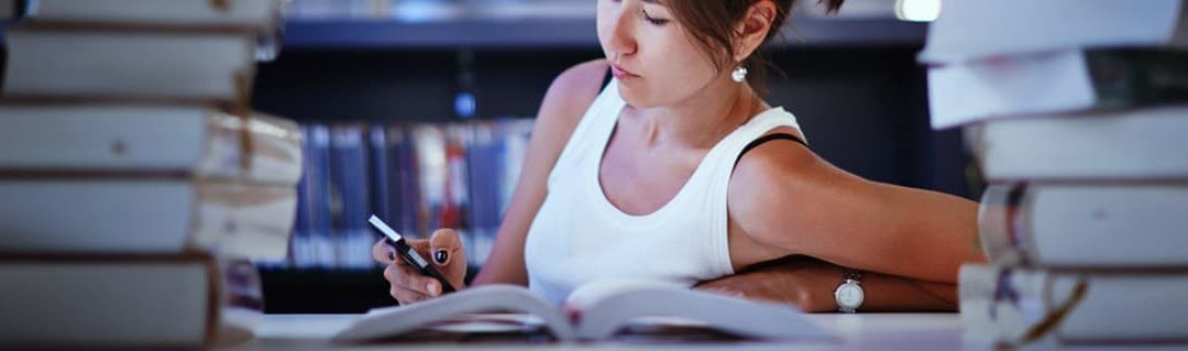 5 Great Reasons To Start A Business At University - image - woman studying in library