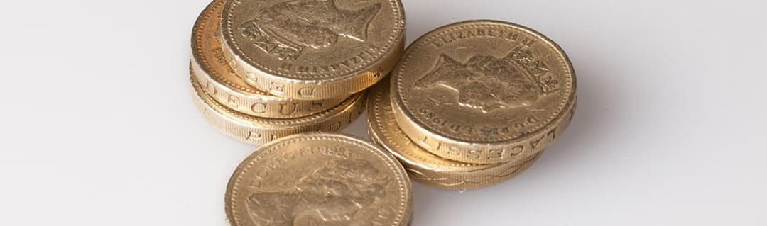 Guide to Managing Cash Flow - image - stacks of pound coins