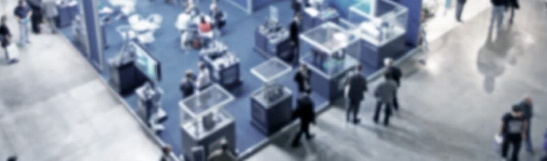 How to make the most of trade shows - Aerial view of a busy trade show/exhibition