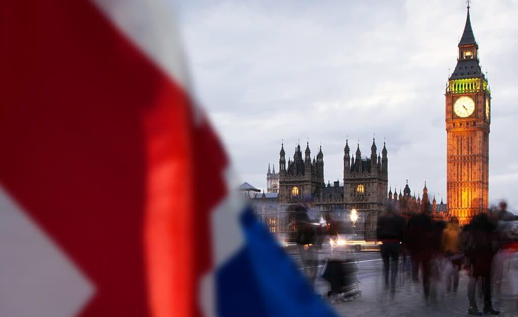 Which Political Party is Best for Small Businesses image - houses of parliament and Big Ben tower in the distance behind a union flag